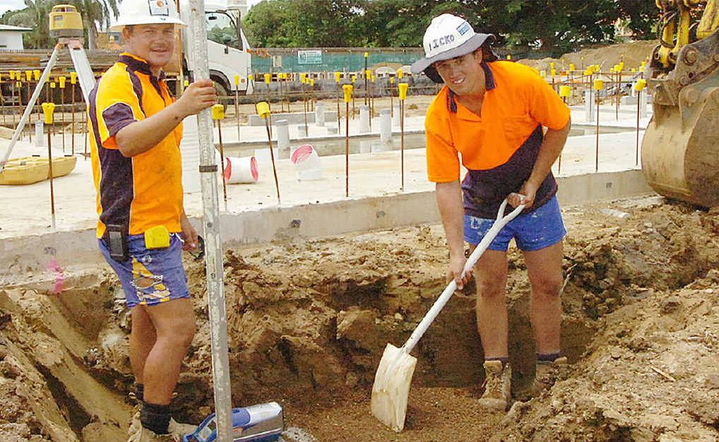 Plumbers Kyle Greaves and Mick Scott dig trenches around the new building’s foundations. Plumbers Kyle Greaves and Mick Scott dig trenches around the new building’s foundations.